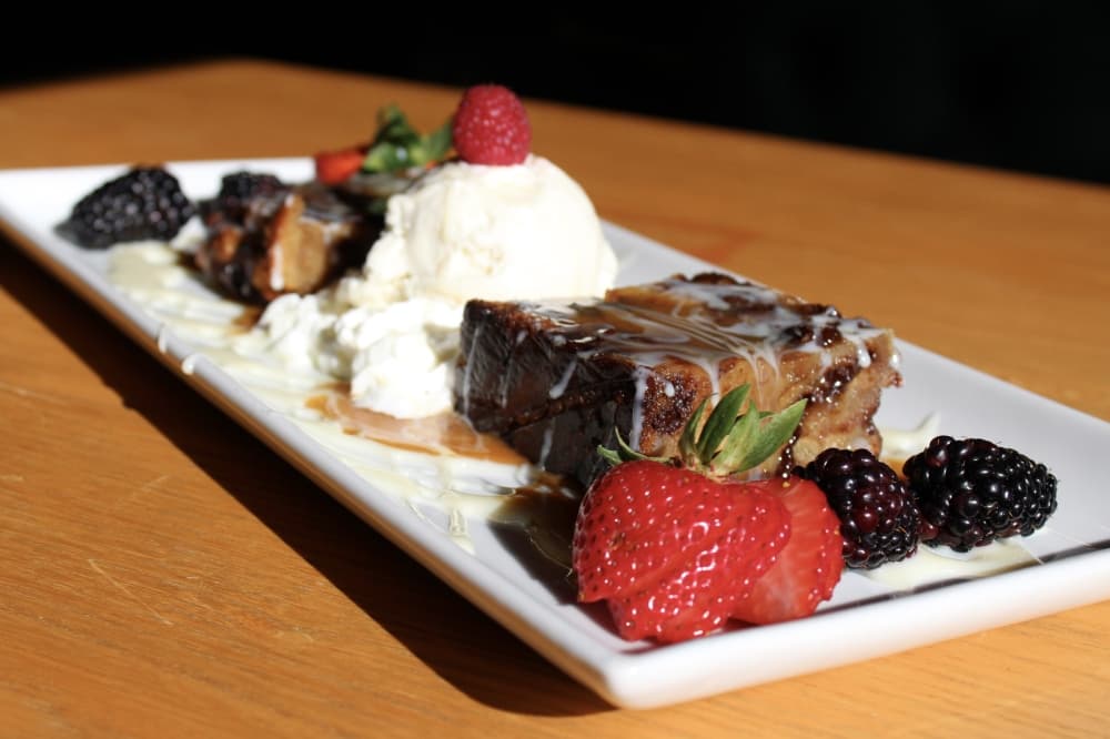 Chocolate chip bread pudding with berries and ice cream