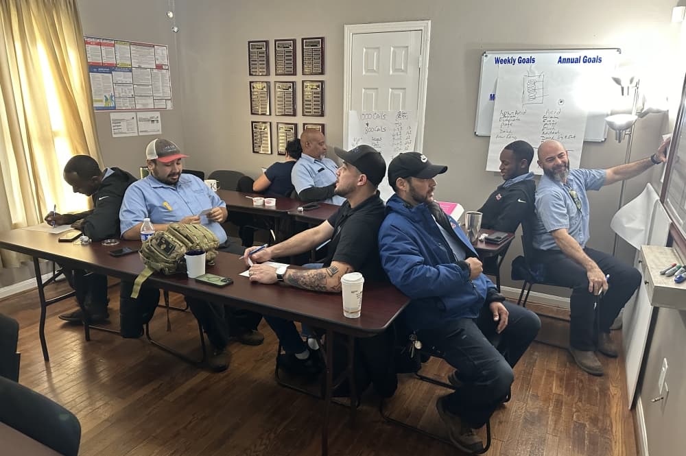 Aire Serv technicians are as committed to their work as they are to building relationships with one another during team meetings. 