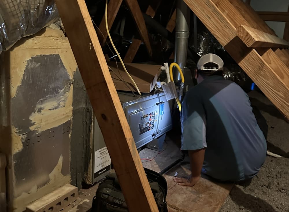 An Aire Serv technician working hard to keep units running and customers comfortable. 