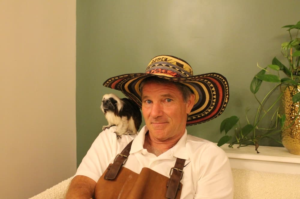 Brandon Fokken with Ambassador Tai, a cotton-top tamarin