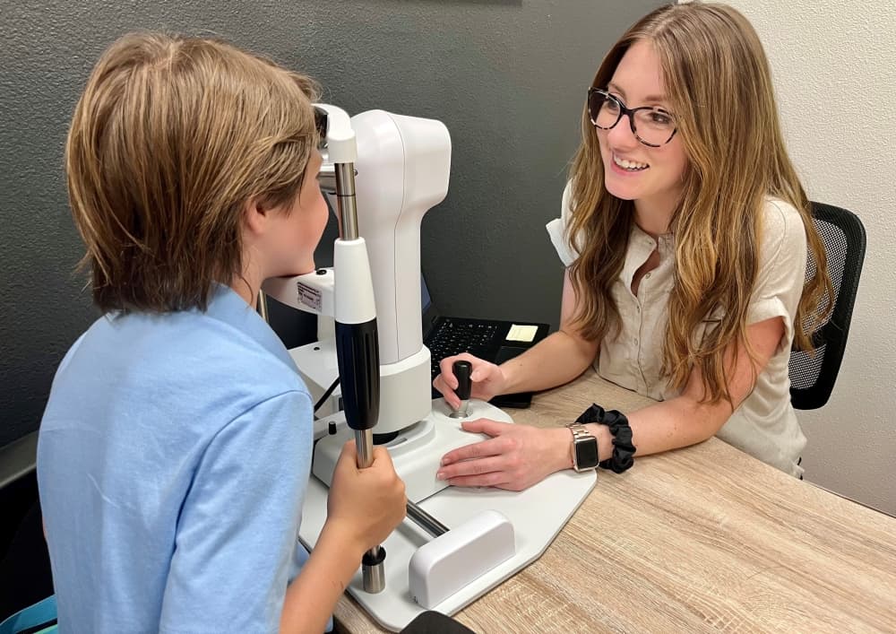 Dr. Browne works with a patient to access his vision skills and tailor a vision therapy treatment plan. 
