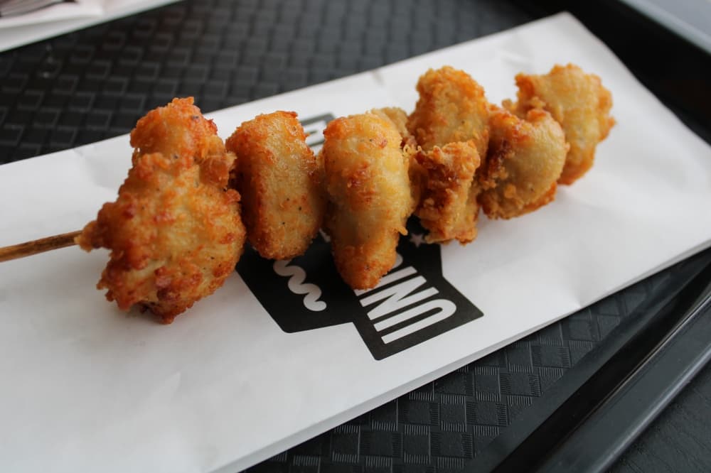 Chicken nuggets on a skewer. 
