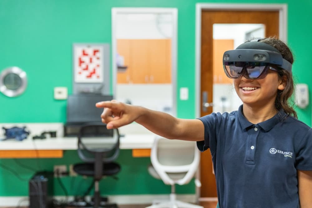 A patient at The Center for Vision Development smiles as she makes progress in her customized vision therapy treatment plan. 