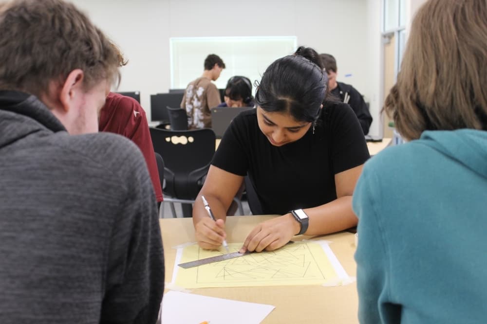 a group of students works on a project together