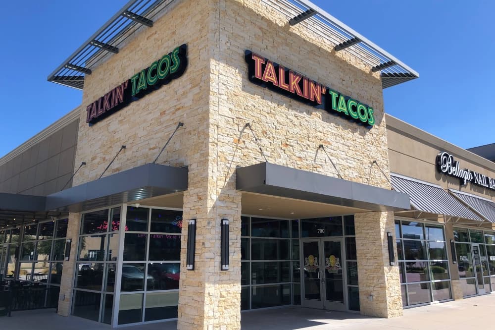 Exterior of building with Talkin' Taco signage. 