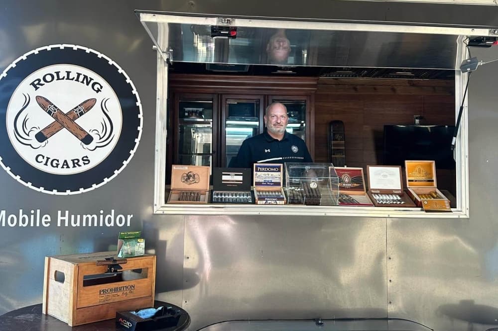 Ron Stevens in the sell window of Rolling Cigars. 