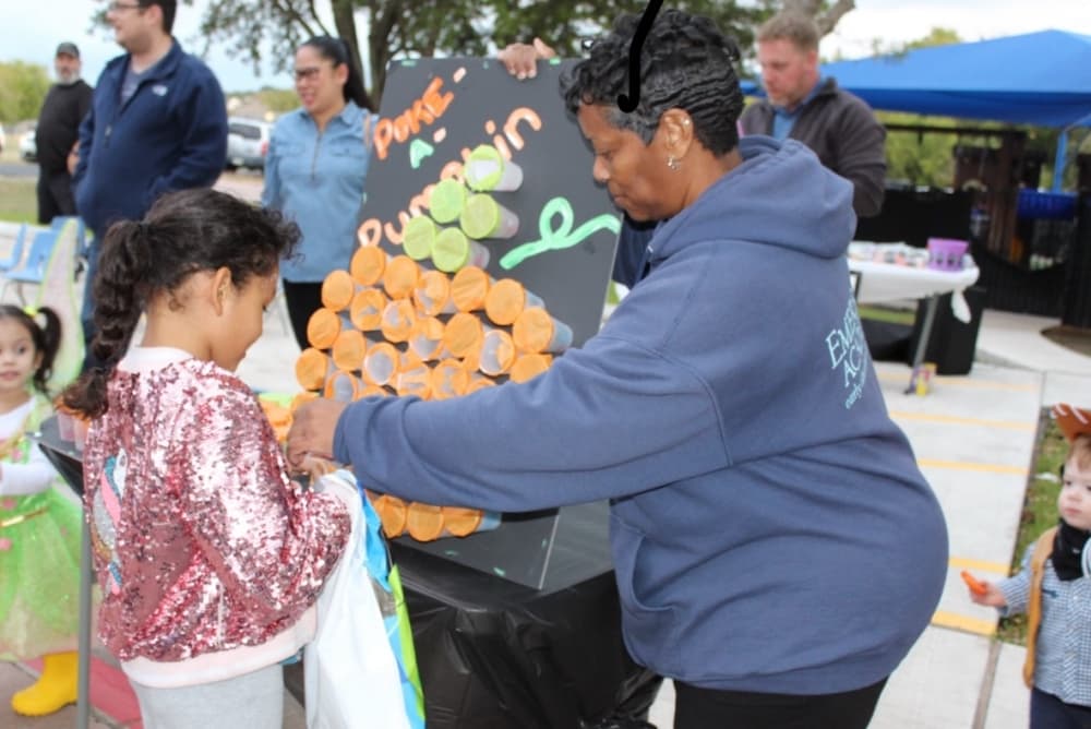 A child is shown a fall-themed game.
