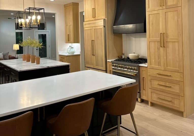 A completed kitchen island with white countertops. 