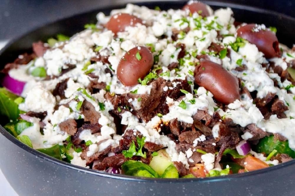 The Greek salad beef shawarma features lettuce, tomatoes, onions, cucumbers, green peppers, olives and feta cheese. (Courtesy Sheesh Kitchen)
