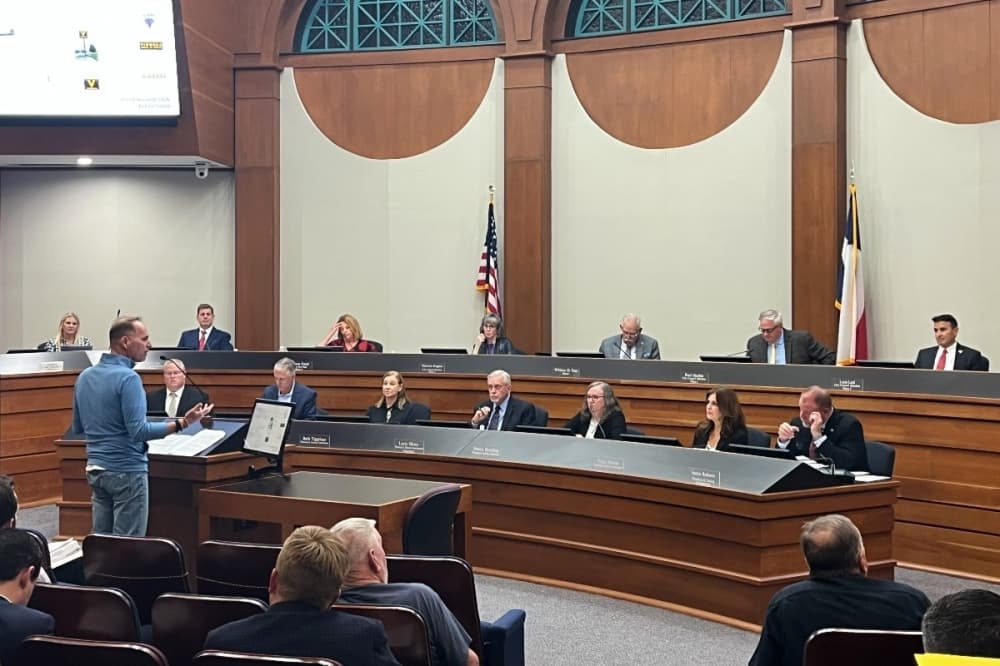 man speaking to council