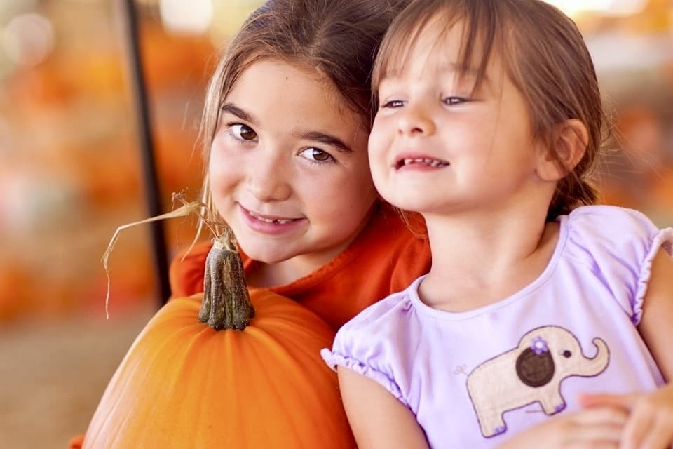 kids with pumpkin