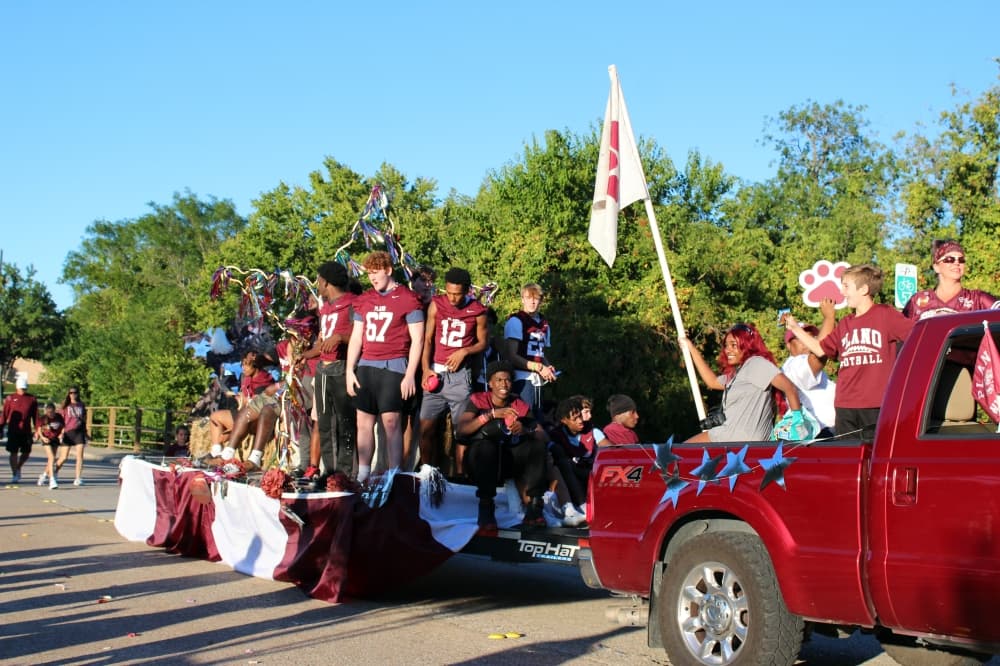 Teens on a float in a parade. 
