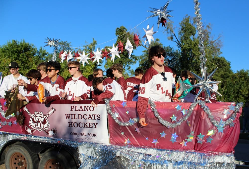 Teens on a float in a parade. 