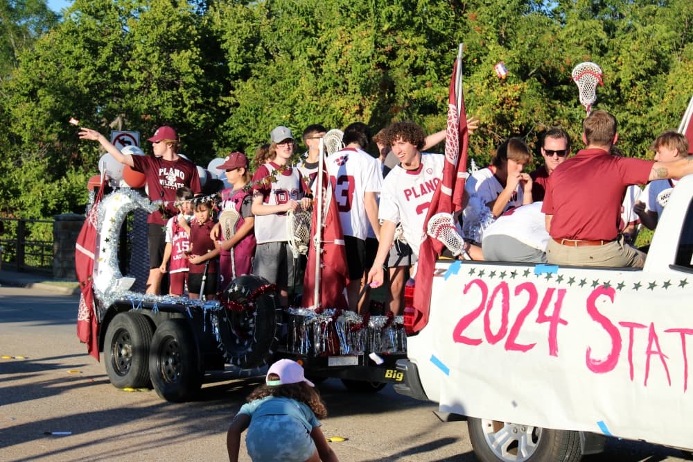 Teens on a float in a parade. 