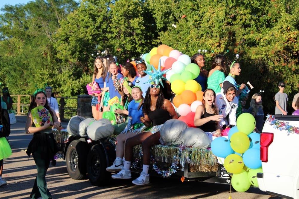 Teens on a float in a parade. 