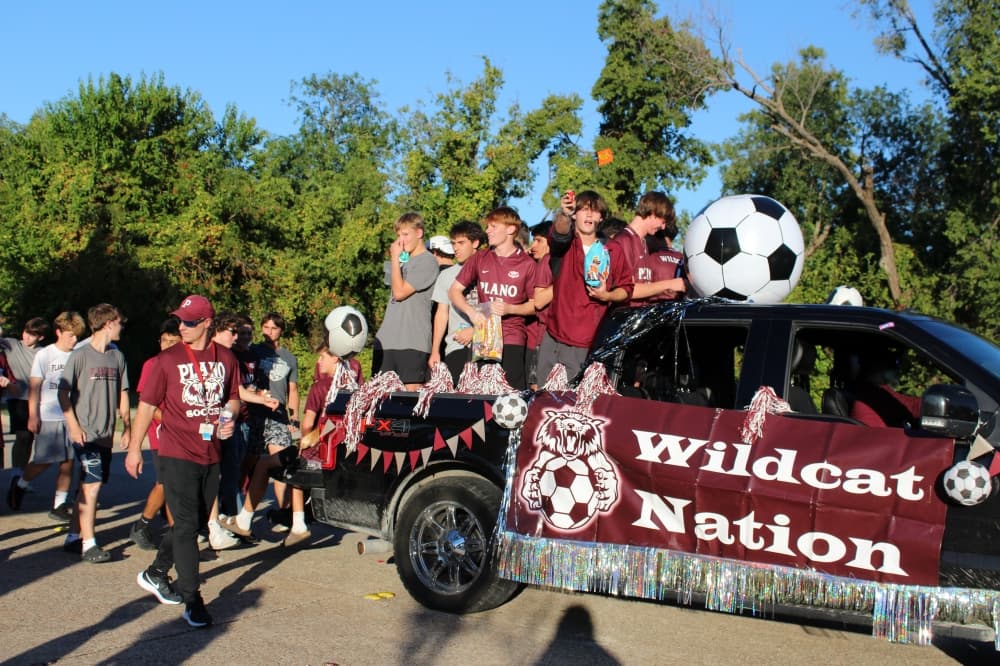 Teens on a float in a parade. 