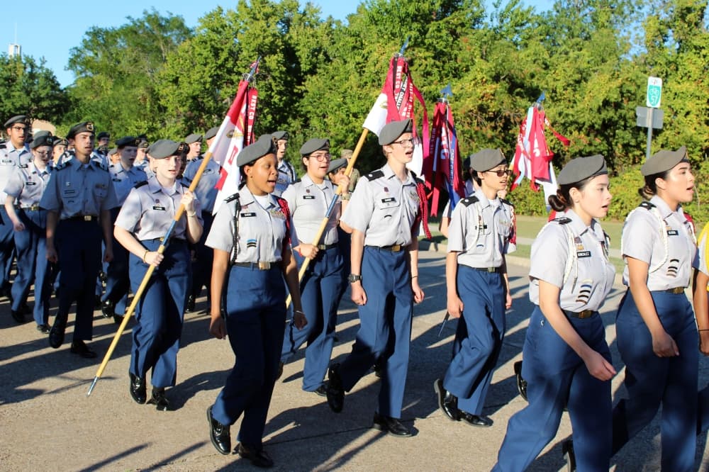 ROTC members marching in a parade.