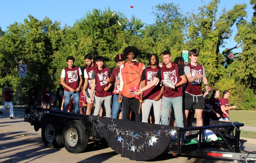 Teens on a float in a parade. 