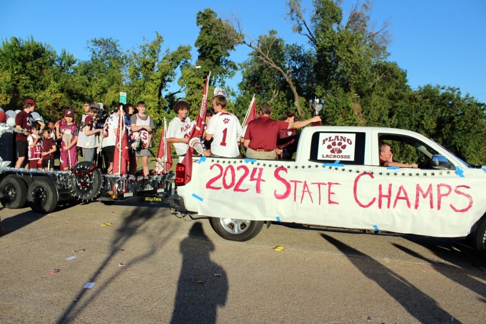 Teens on a float in a parade. 