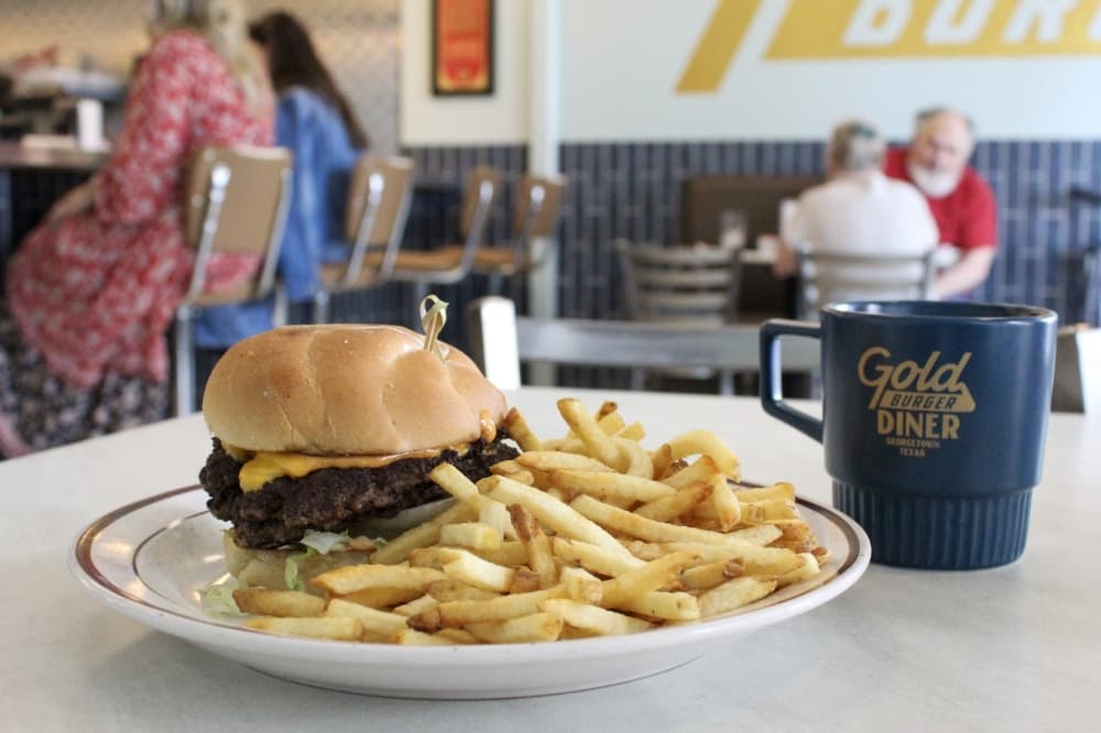An image of the Gold Standard Burger served at the restaurant. 