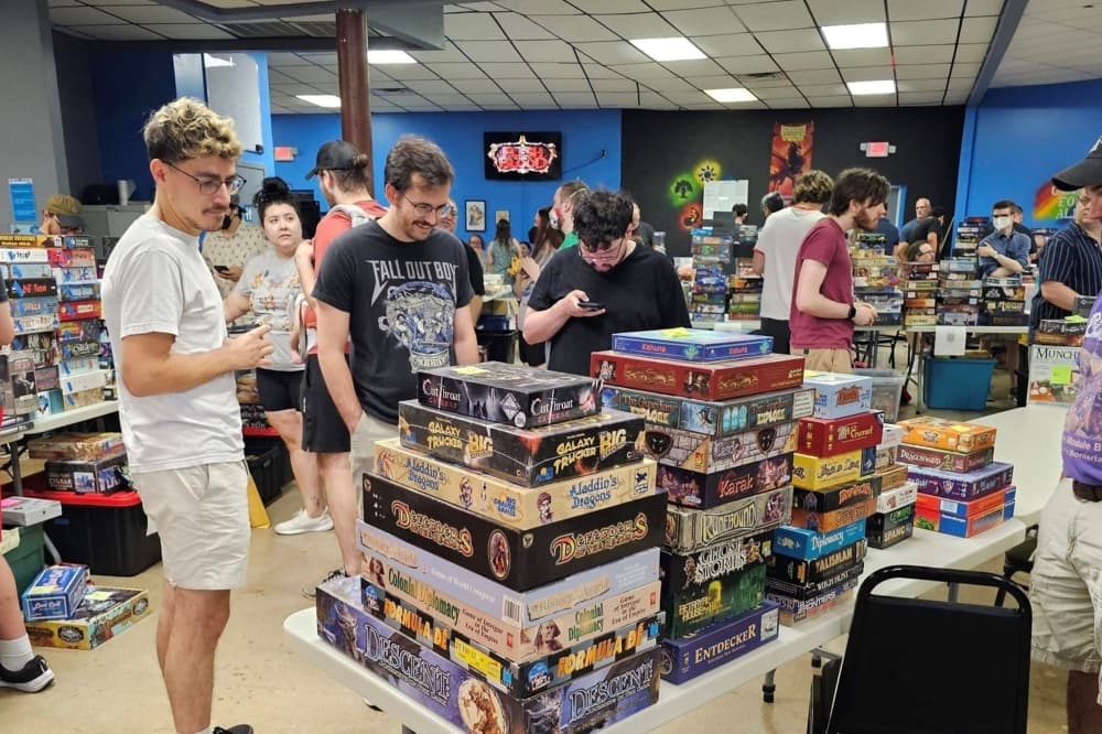 An image of people shopping for board games at a previous Game Kastle event. 