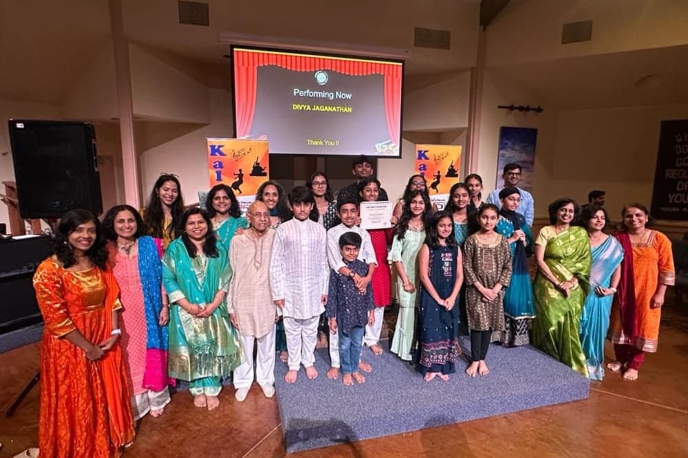 A group photo of a musical group that participated at a previous India Music Festival. 