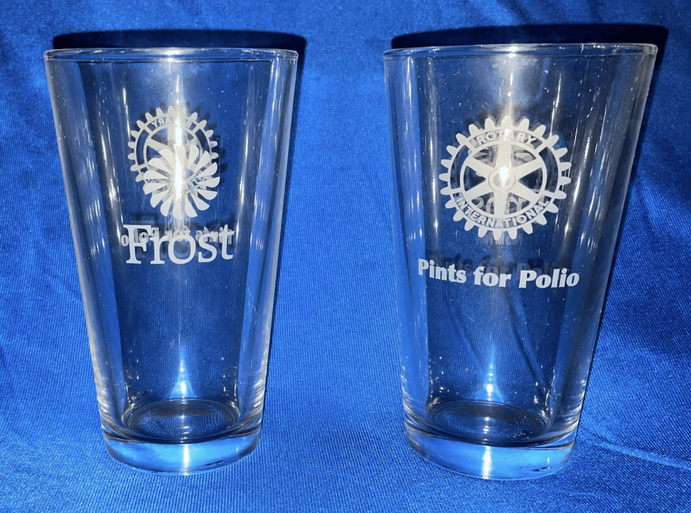 Two pint glasses are shown, one side shows "Pints for Polio" with the Rotary emblem, and the other side shows Frost Bank and its emblem.