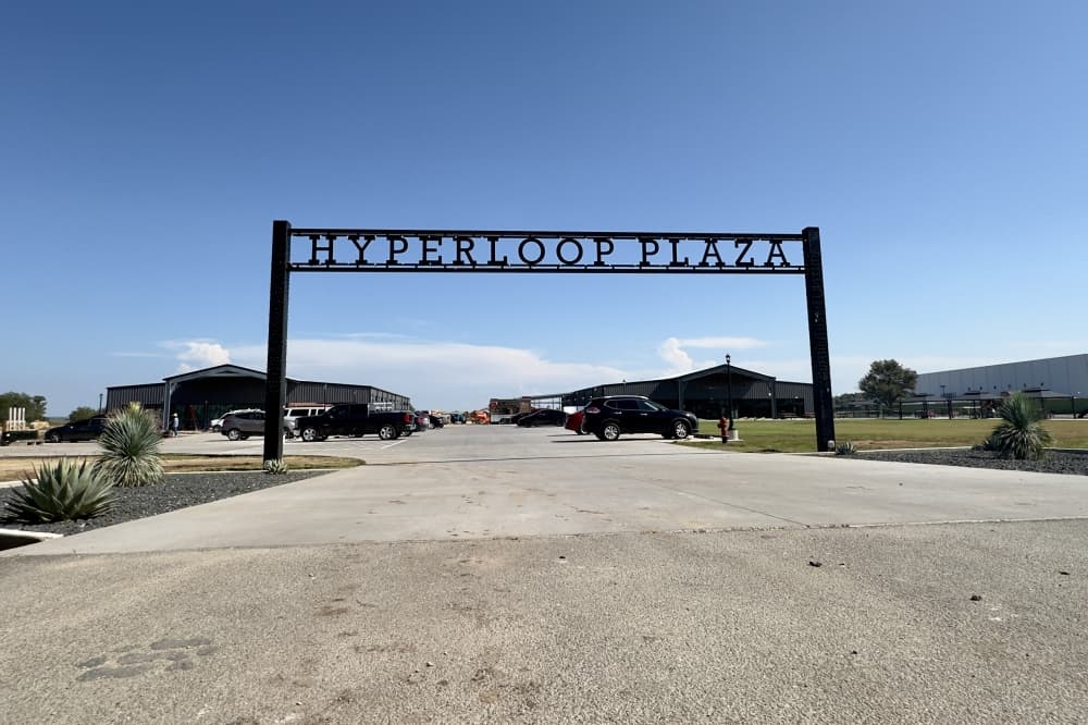 The Hyperloop Plaza gate sign is shown.