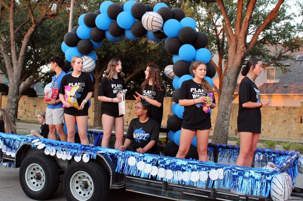 Students on a trailer in a parade.