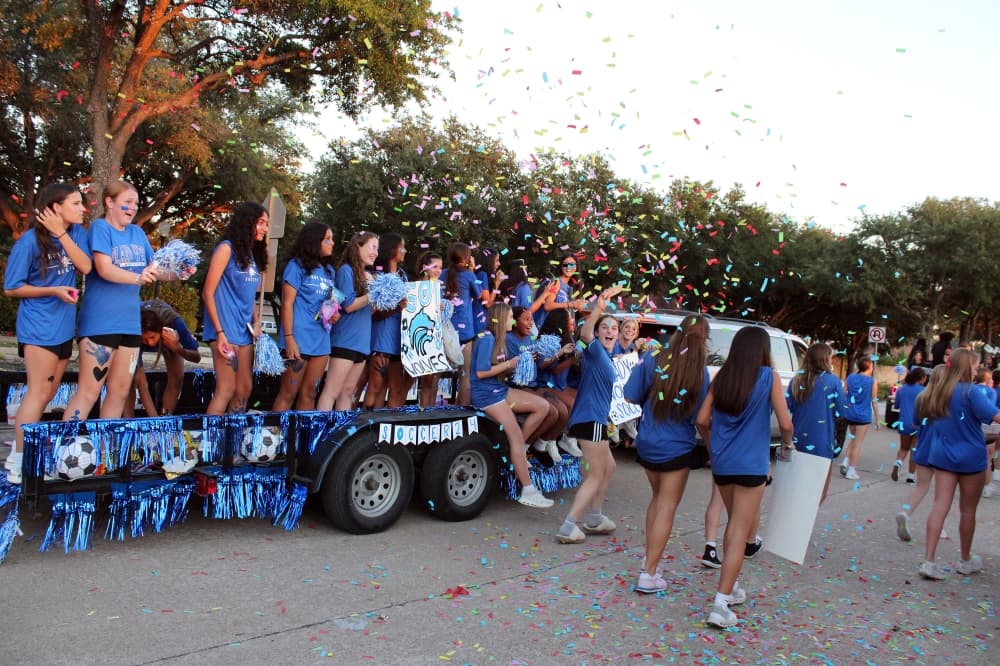 Students on a trailer in a parade.