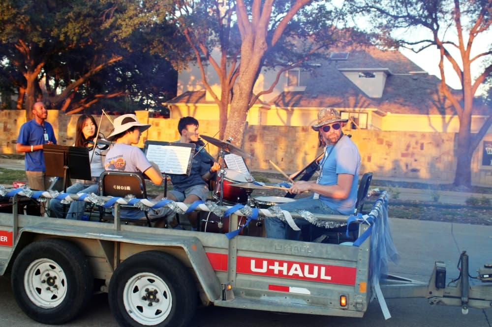 Students on a trailer in a parade.