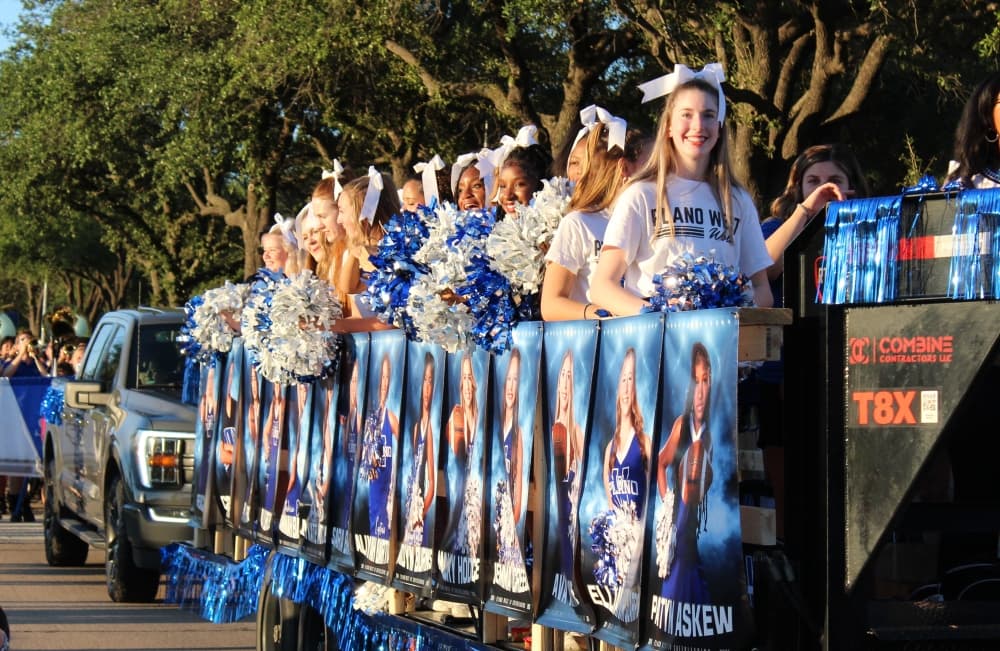Students on a trailer in a parade.