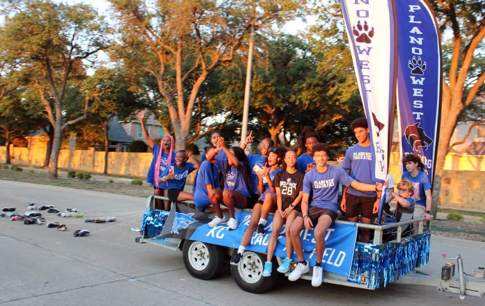 Students on a trailer in a parade.