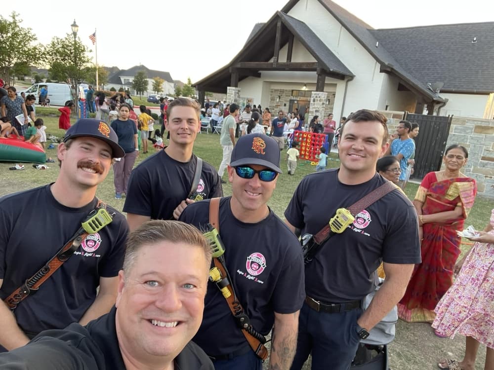 Prosper Fire Department members stand for a photo at an Oct. 1 National Night Out party. (Courtesy town of Prosper)