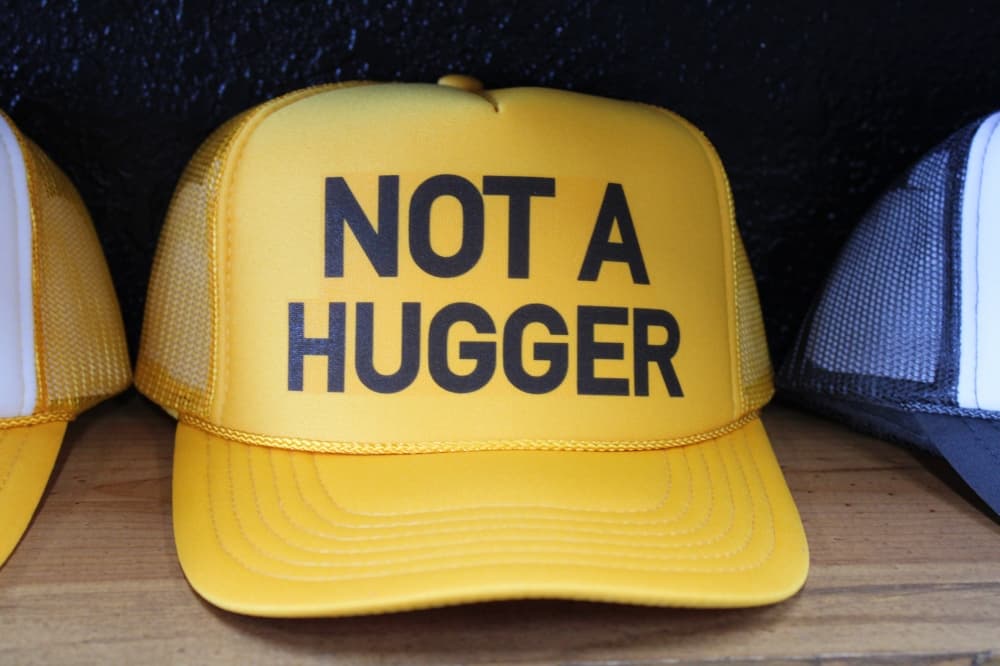 A hat that says "not a hugger."
