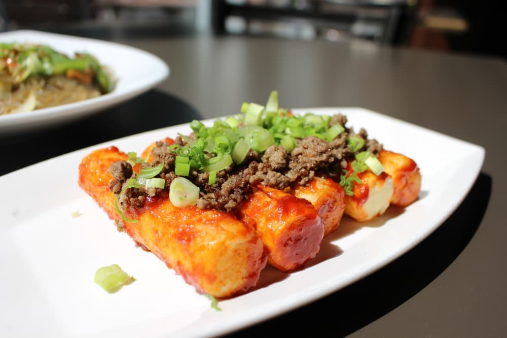 Tteok, pronounced "duck," is a classic Korean dish of fried rice cakes. (Asia Armour/Community Impact)