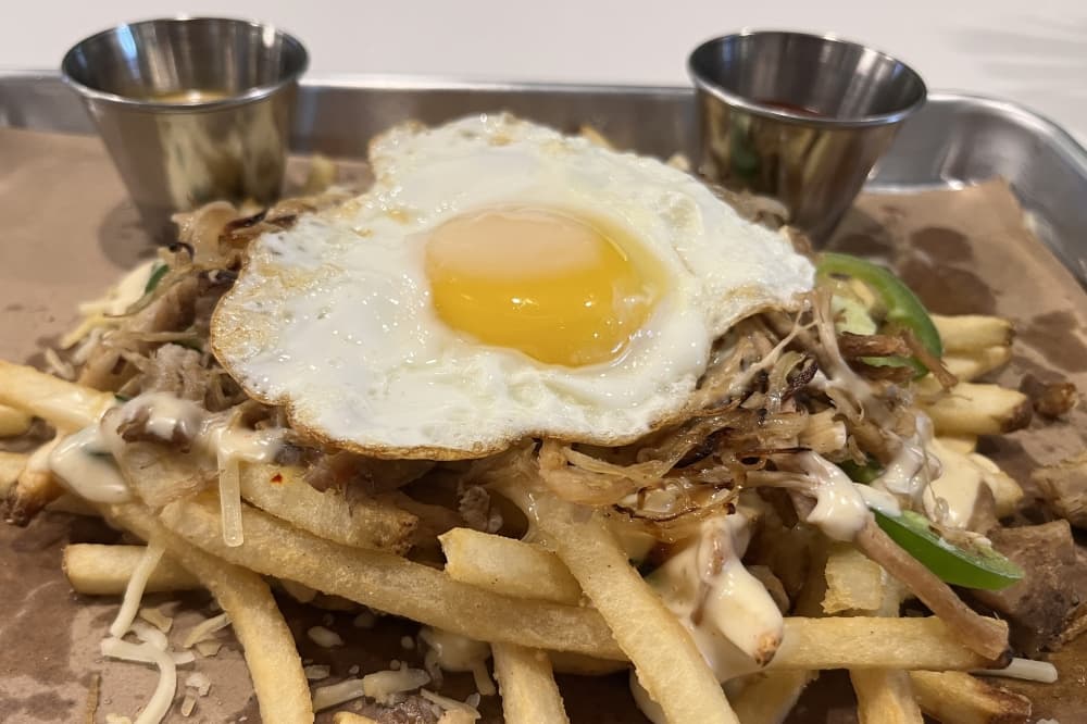 Texas poutine is one of the unique food options Hoppin' has on its menu. (Gabby Bailey/Community Impact)
