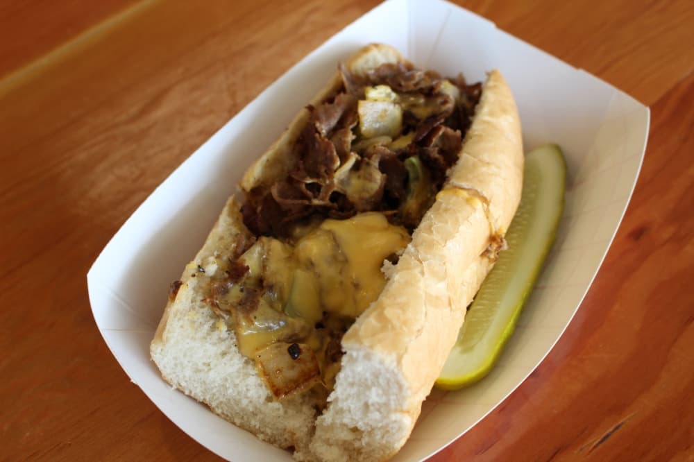The cheesesteak ($12) is ribeye, onions, green bell peppers and melted American cheese. (Sarah Hernandez/Community Impact)