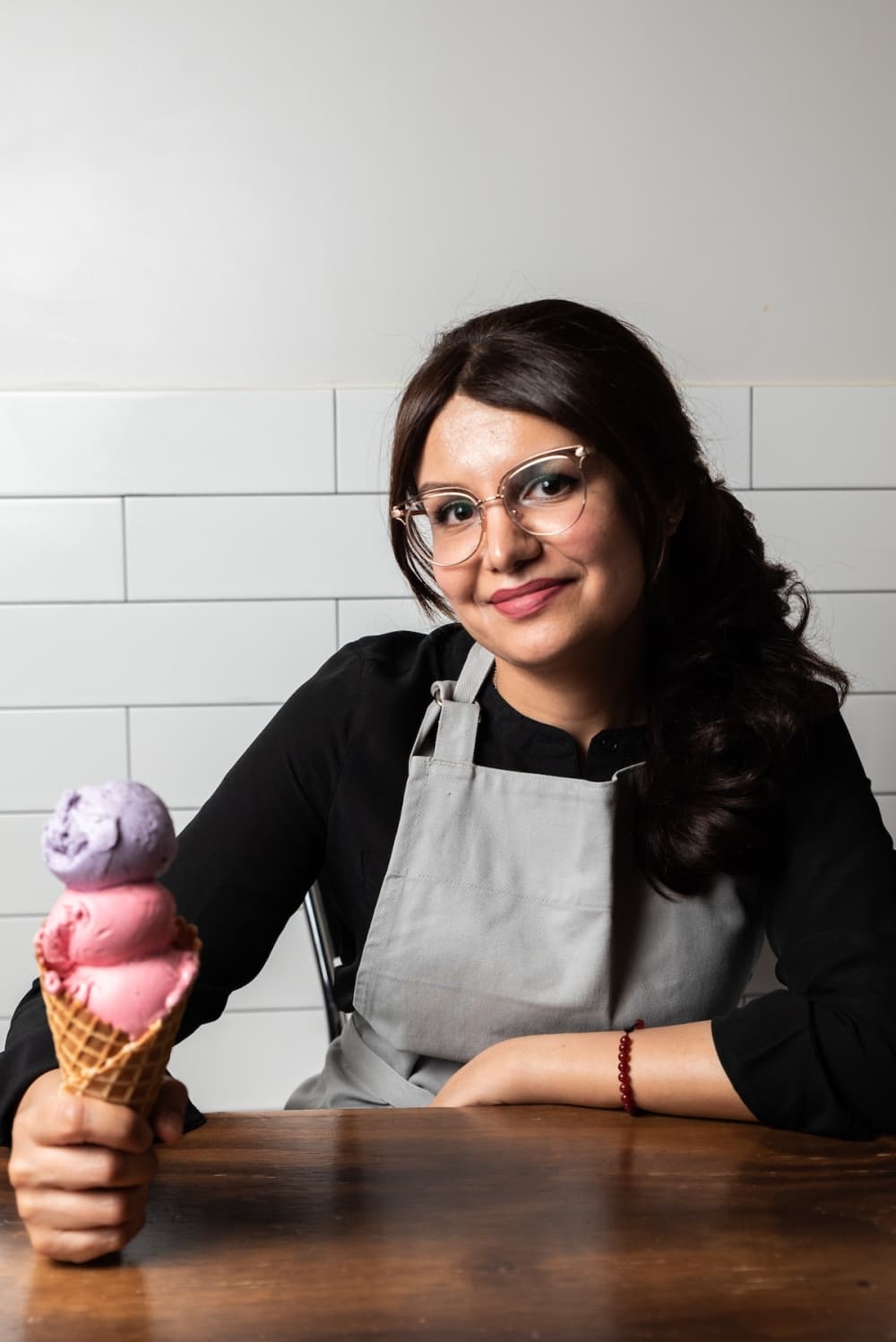 business owner holding an ice cream cone