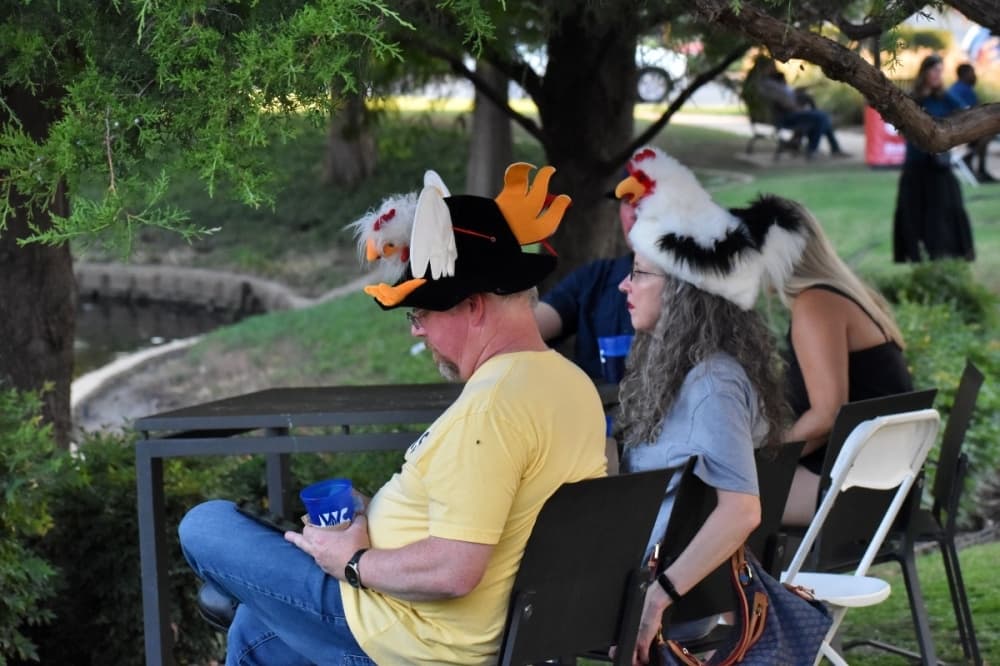 people wearing unique hats 