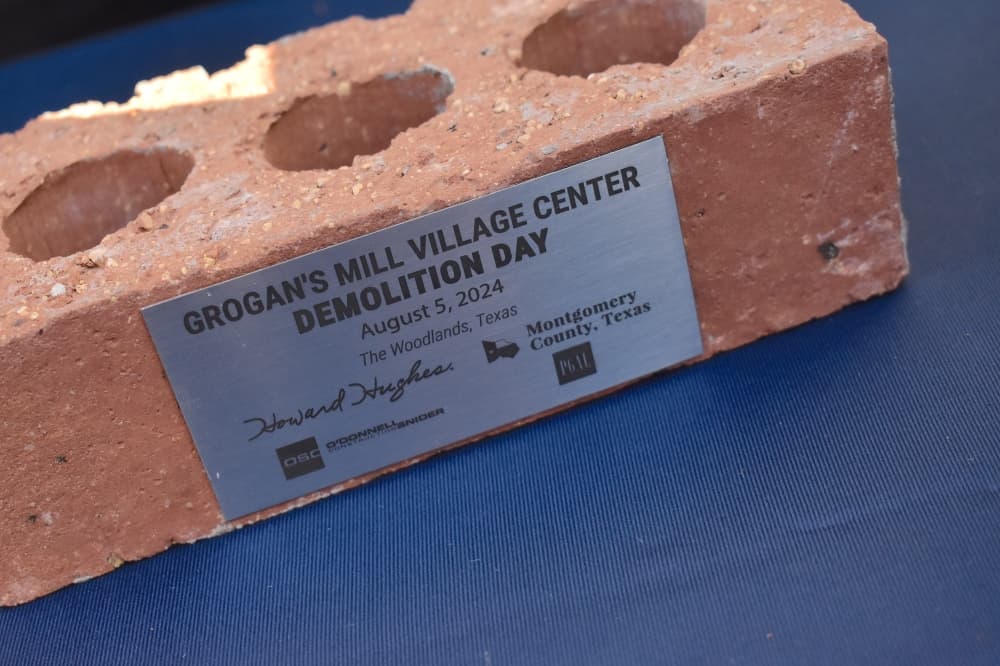 A brick with a plaque on it
