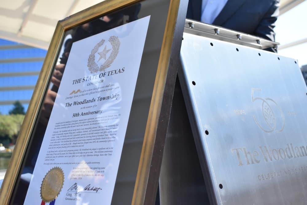 A framed document and a box