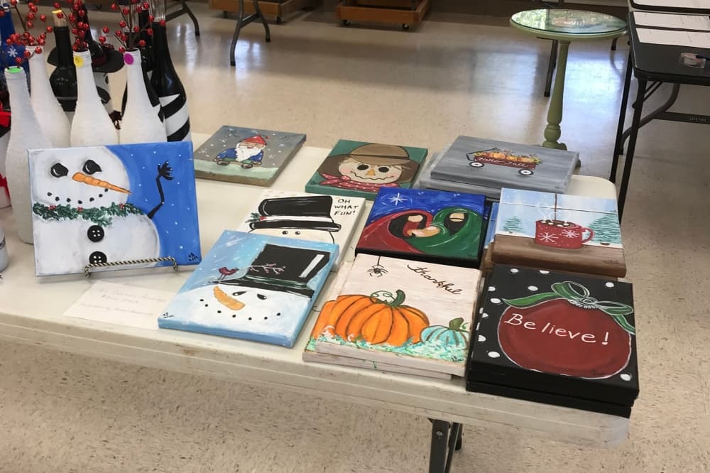 An image of some paintings sold at a previous event at the church. 