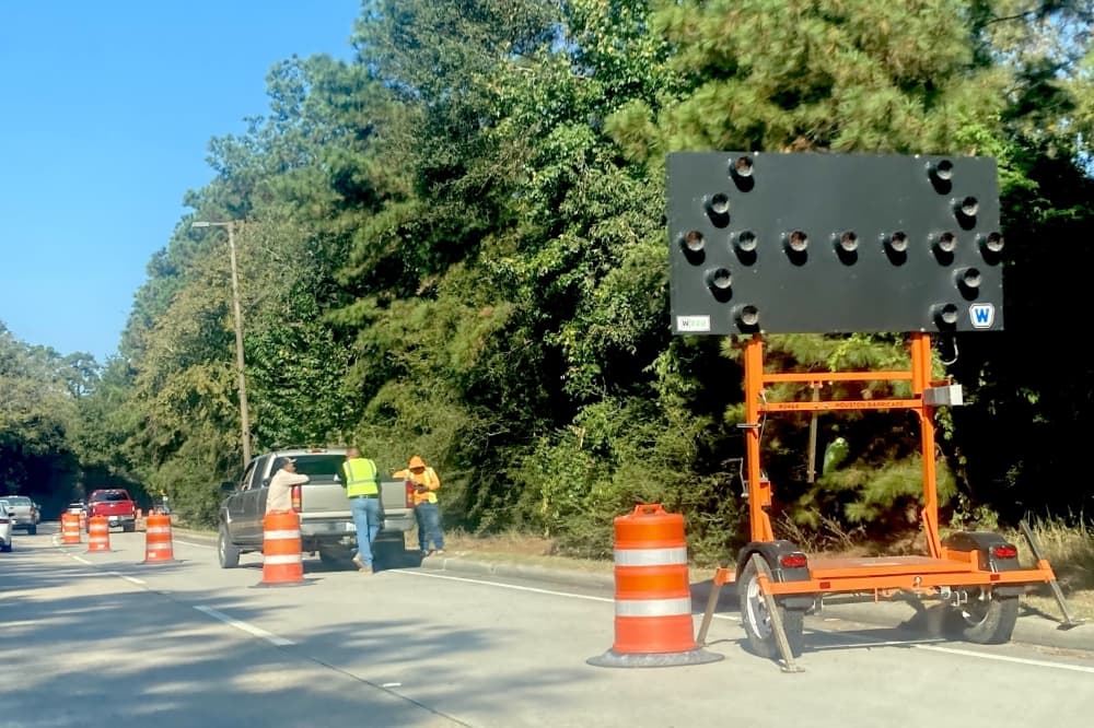 The Woodlands Township conducts invasive vine removal operations on Woodlands Parkway