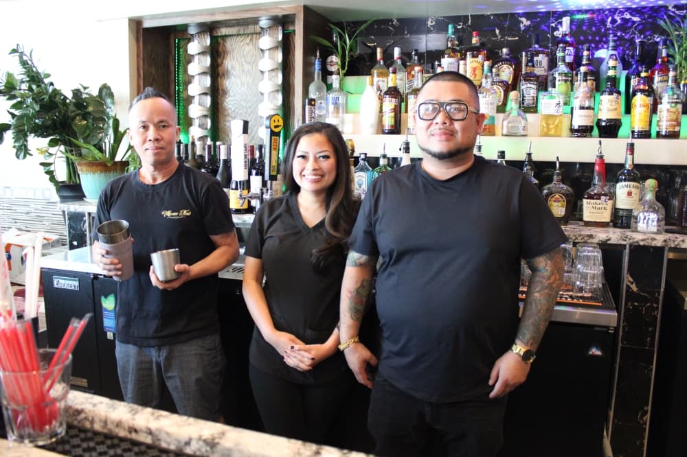 People behind the counter at Manee Thai. 