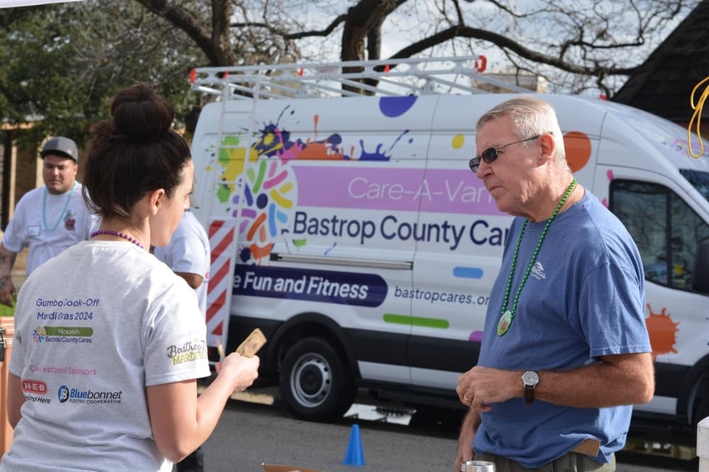 An image of a a volunteer answering a question. 