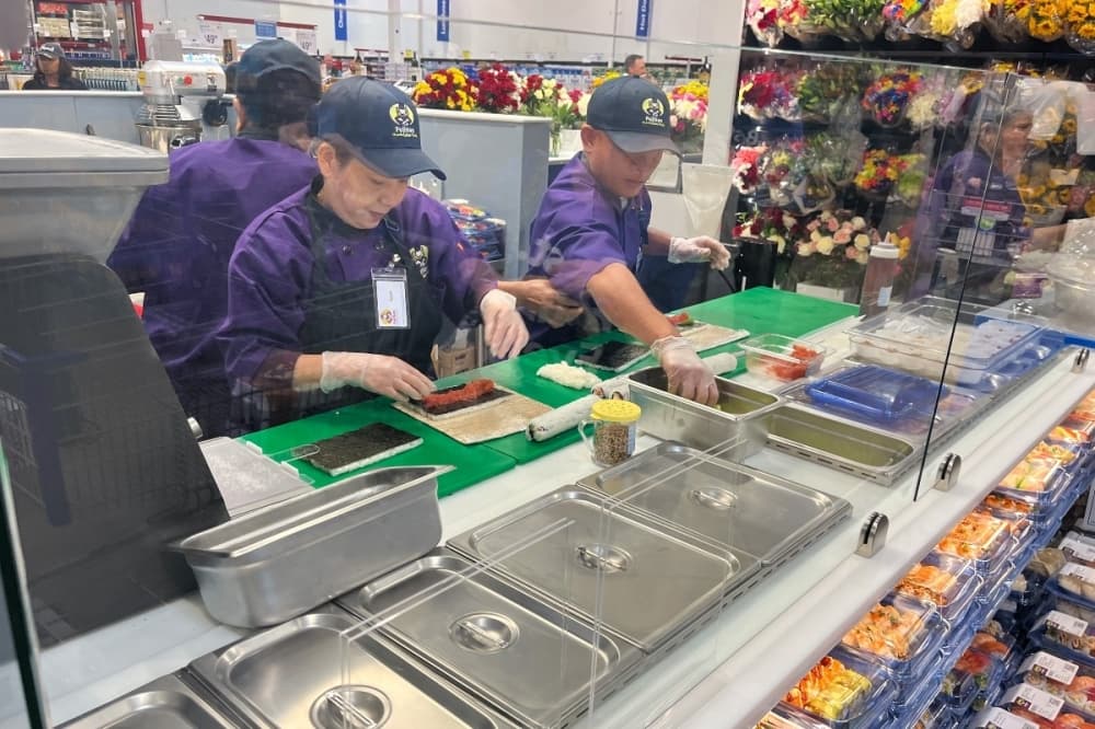person making sushi 