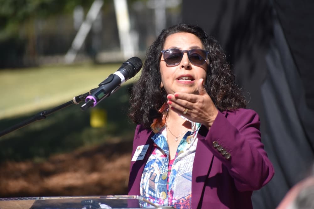 woman speaking at podium