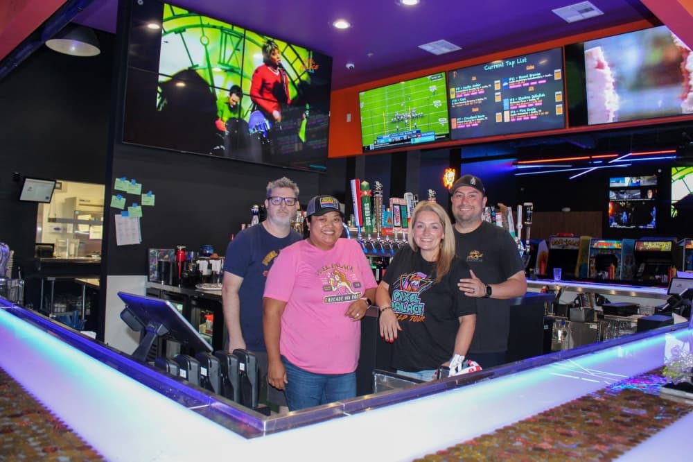 An image of the owners of the bar. 