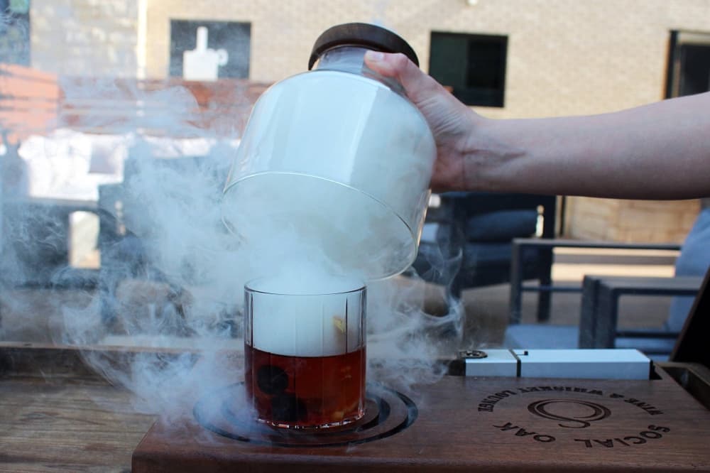 Alcoholic beverage with smoke effects.
